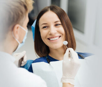 Smiling girl with dentist in Whitby.