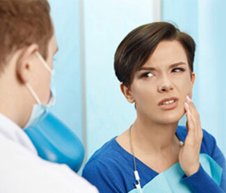 Dentist Girl in teeth pain